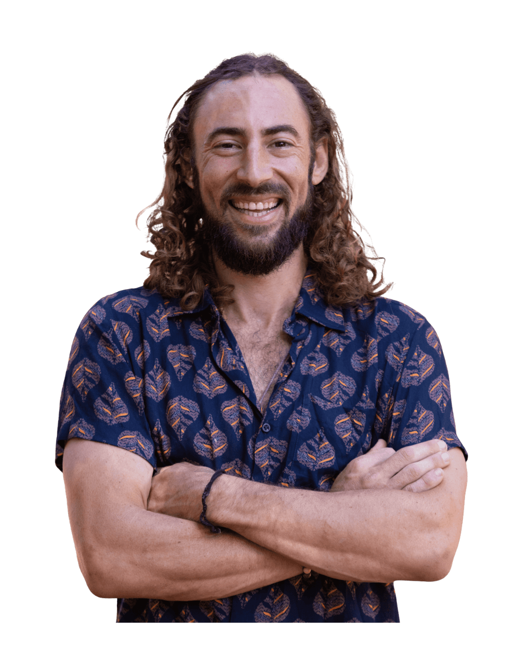 Ben Milston smiling, arms crossed, in a patterned shirt